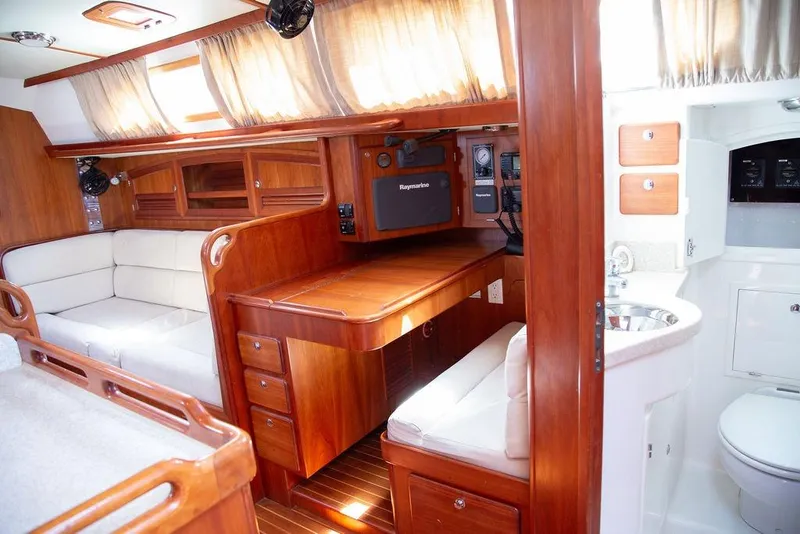 Slide: The Image of Luxurious interior of 2015 Outbound 46 yacht with wood finish and navigation equipment. - 32