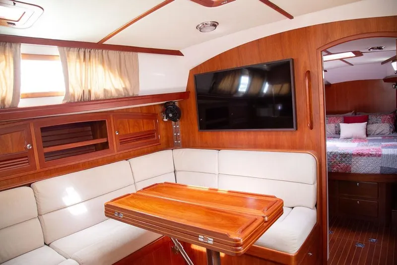 Slide: The Image of Luxurious interior of 2015 Outbound 46 yacht with wood finish and cozy seating area. - 33