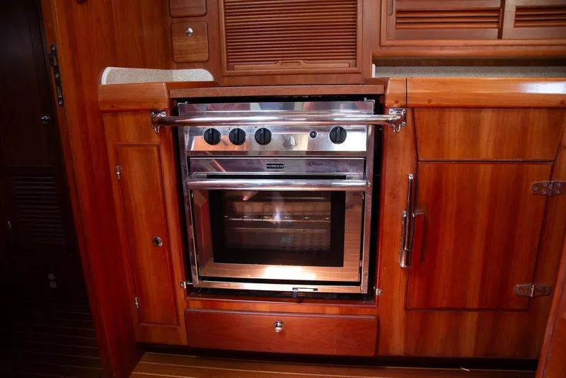 Slide: The Image of Wooden yacht kitchen with stainless steel oven, Outbound 46, 2015 model. - 39