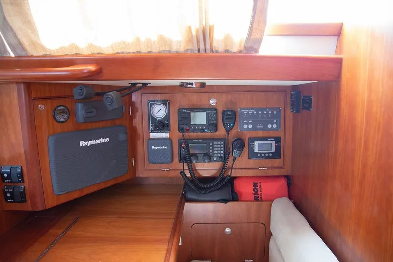 Slide: The Image of Navigation equipment inside a 2015 Outbound 46 yacht, featuring Raymarine systems. - 41