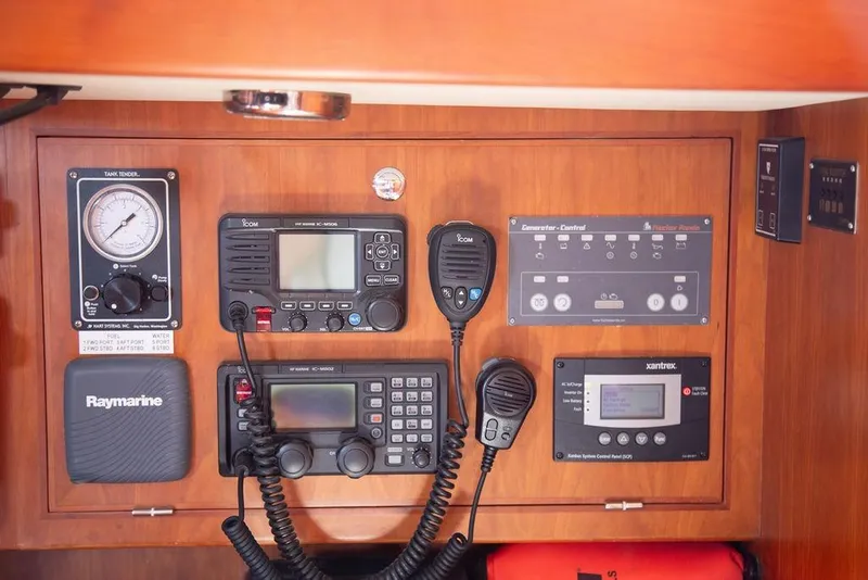 Slide: The Image of Control panel of a 2015 Outbound 46 yacht with navigation and communication equipment. - 43
