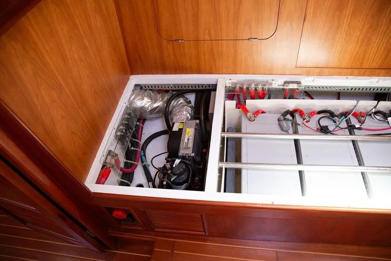 Slide: The Image of Electrical system of a 2015 Outbound 46 yacht, featuring wiring and battery setup. - 46