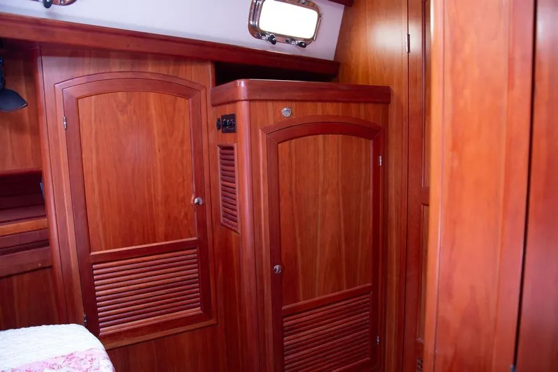 Slide: The Image of Wooden interior of 2015 Outbound 46 yacht, featuring elegant cabinetry and doors. - 50