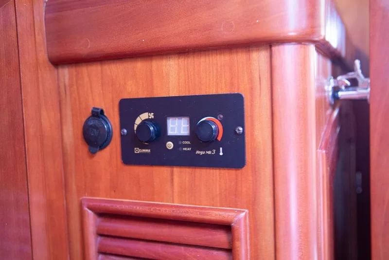 Slide: The Image of Control panel on 2015 Outbound 46 yacht with wooden interior. - 51