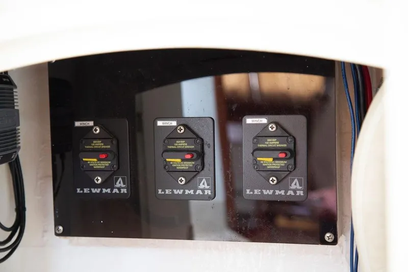 Slide: The Image of Control panel with Lewmar winch switches on a 2015 Outbound 46 yacht. - 62