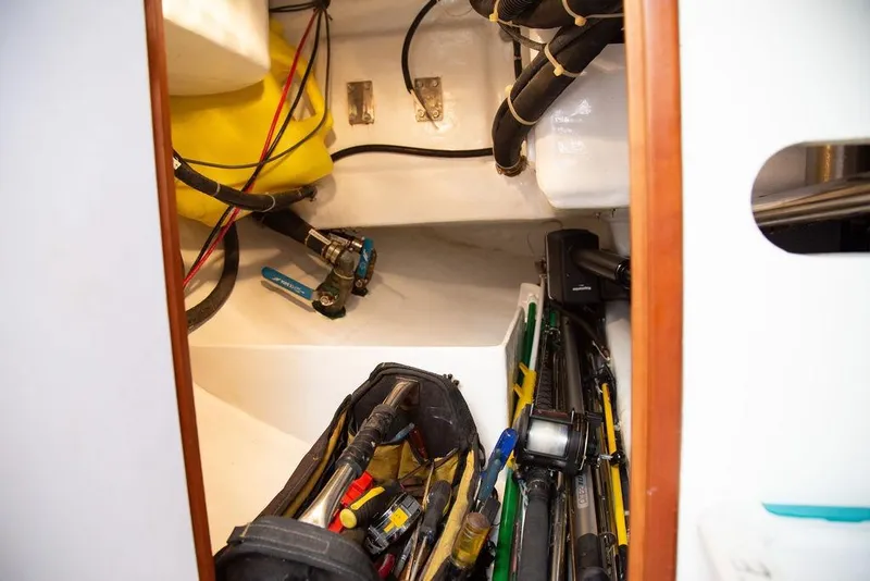 Slide: The Image of Storage compartment of 2015 Outbound 46 yacht with tools and equipment. - 69