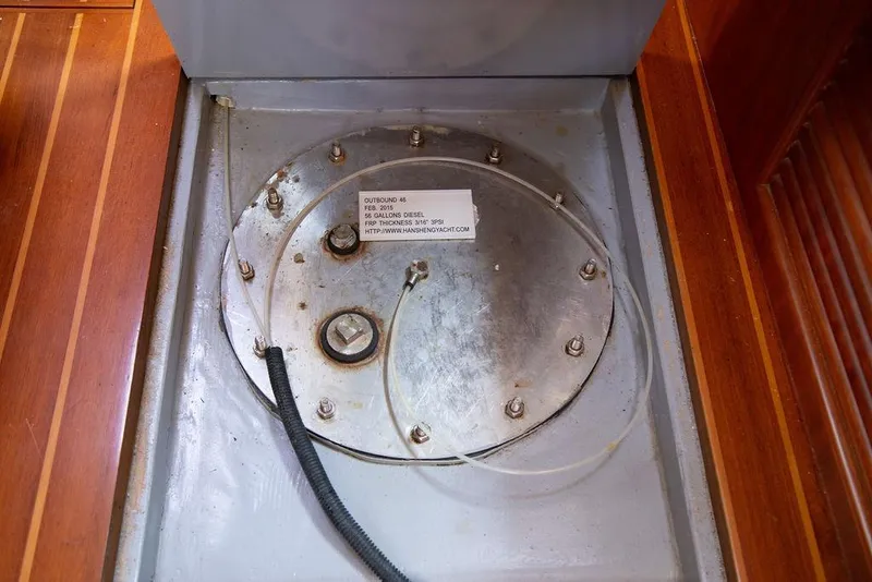 Slide: The Image of Fuel tank access panel on 2015 Outbound 46 yacht, featuring diesel capacity details. - 77