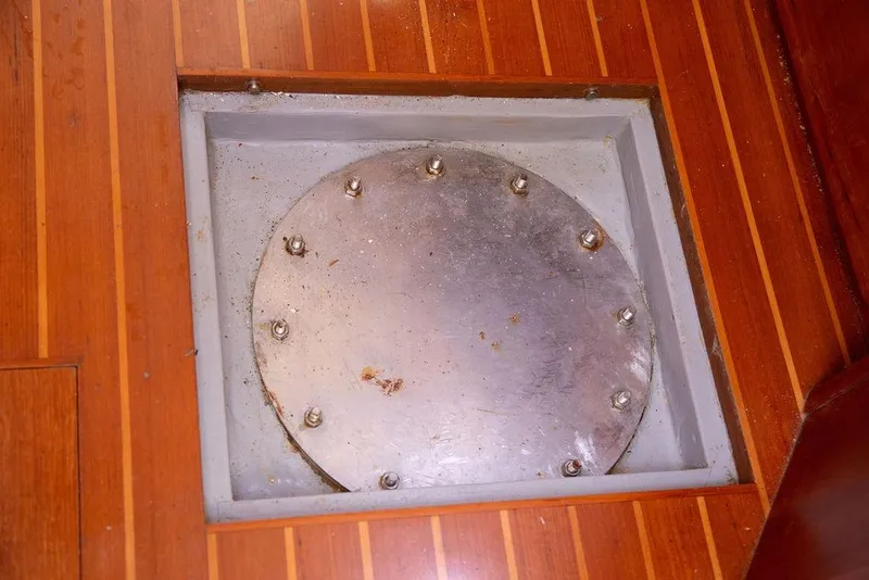 Slide: The Image of Metal hatch on wooden floor of 2015 Outbound 46 yacht. - 79