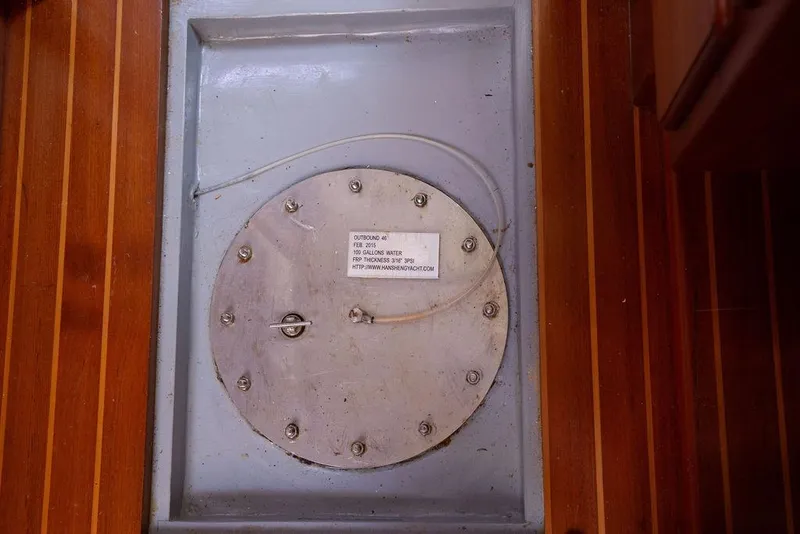 Slide: The Image of Circular metal hatch on Outbound 46 yacht, 2015 model, with wooden flooring. - 81