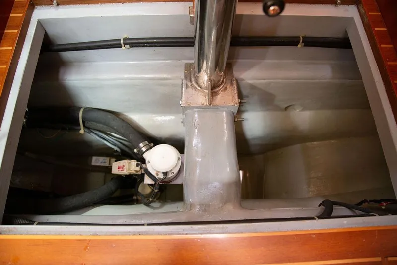 Slide: The Image of Engine compartment of a 2015 Outbound 46 yacht, showing pipes and fittings. - 82