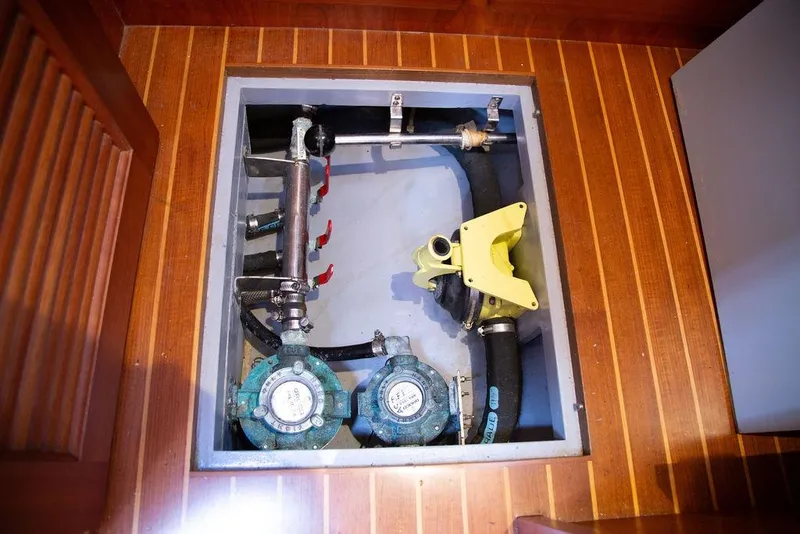 Slide: The Image of Mechanical components in the engine room of a 2015 Outbound 46 yacht. - 84