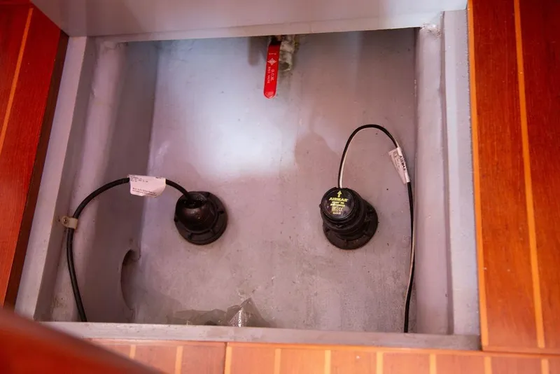 Slide: The Image of Bilge compartment of 2015 Outbound 46 yacht with wiring and valve. - 85