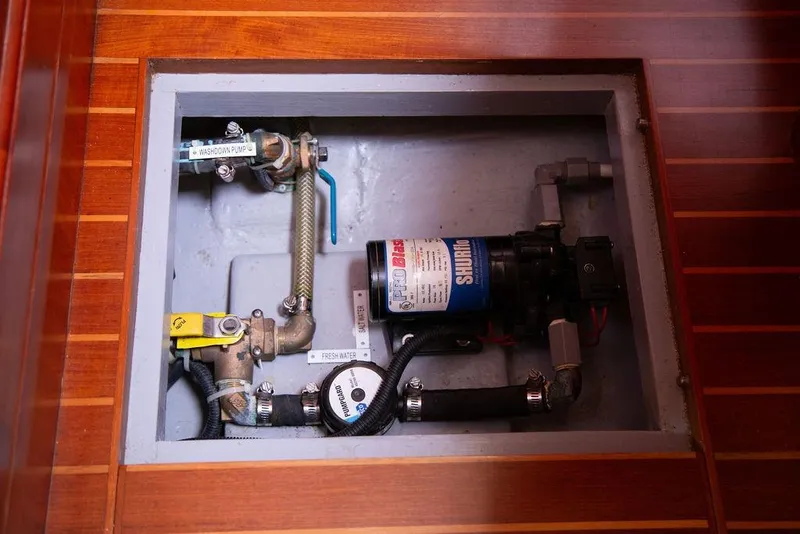 Slide: The Image of Boat plumbing system with Shurflo pump in 2015 Outbound 46 model. - 90