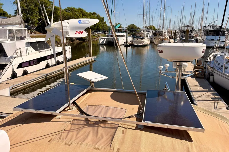 Slide: The Image of Sailboat docked with solar panels and wind turbine, Outbound 46, 2015 model. - 93