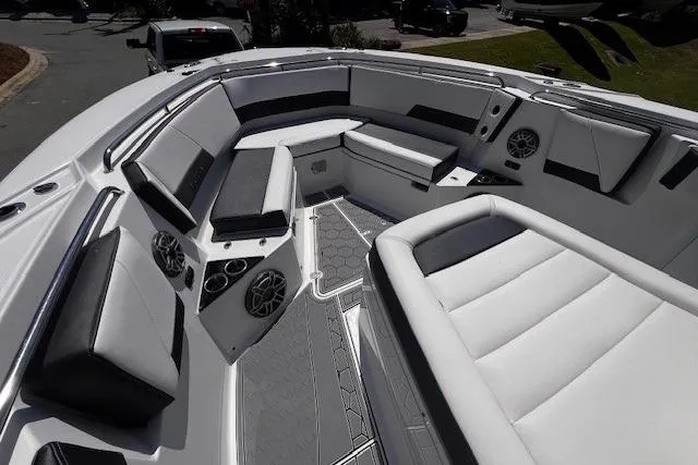 Slide: The Image of Luxurious seating area on a 2020 Blackfin 332 CC boat, featuring modern design and speakers. - 17