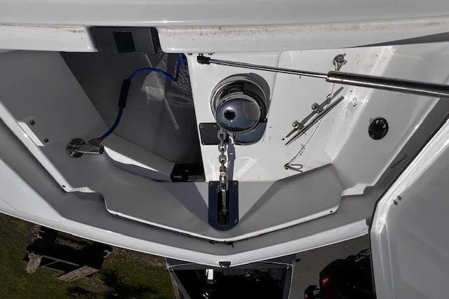 Slide: The Image of Anchor compartment of 2020 Blackfin 332 CC boat, featuring winch and chain. - 19