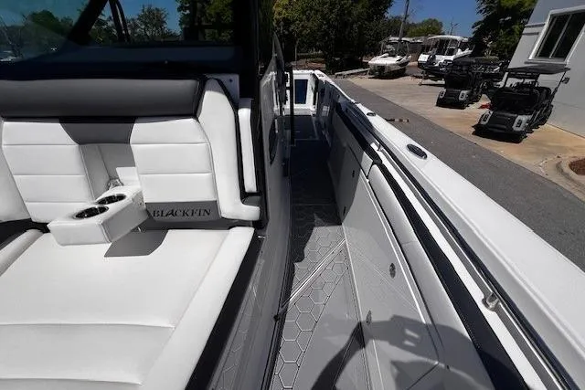 Slide: The Image of 2020 Blackfin 332 CC boat interior with white seating and sleek design. - 21