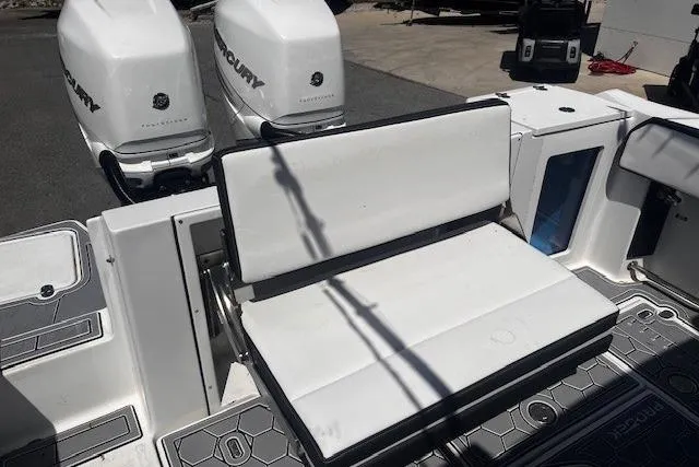 Slide: The Image of 2020 Blackfin 332 CC boat with dual Mercury engines and white seating area. - 26