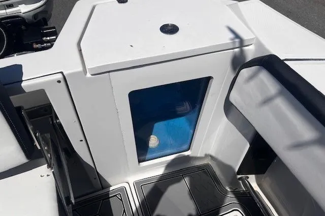 Slide: The Image of 2020 Blackfin 332 CC boat interior with seating and storage compartment. - 28