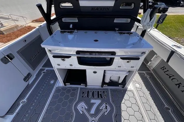 Slide: The Image of 2020 Blackfin 332 CC boat interior with fishing station and "Lucky 7" deck design. - 29