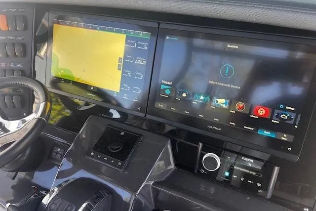 Slide: The Image of Dashboard of a 2020 Blackfin 332 CC boat with advanced navigation displays. - 8