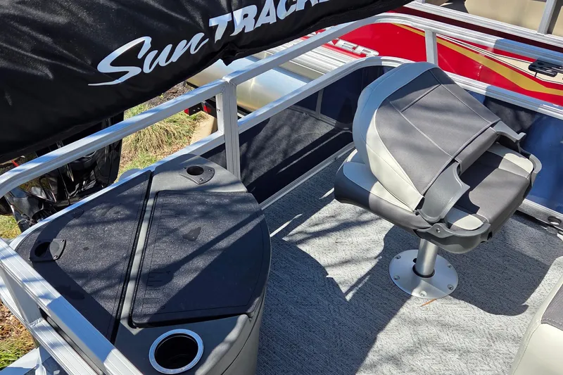 Slide: The Image of 2026 Sun Tracker Bass Buggy 18 DLX boat interior with seating and storage. - 3