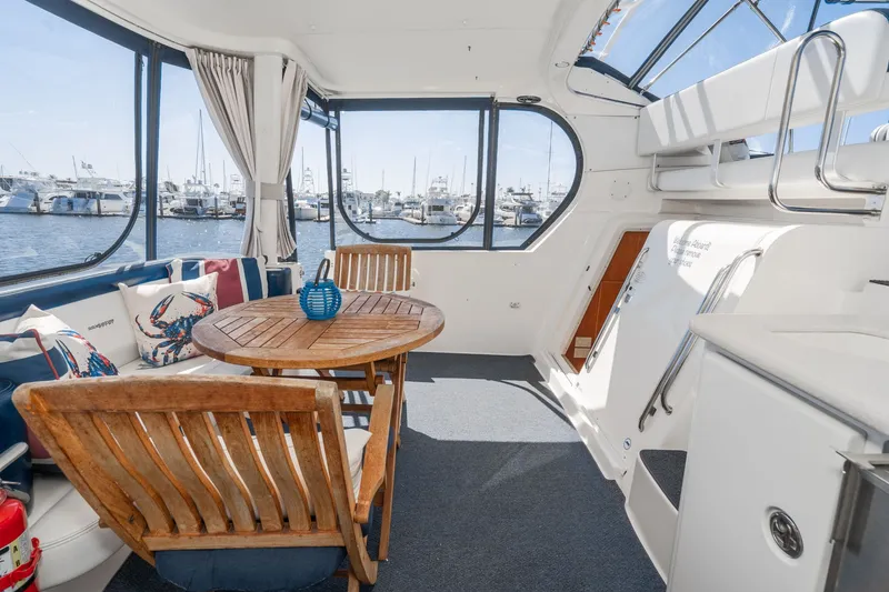 Slide: The Image of Interior of a 2004 Silverton 39 MY Diesel yacht with wooden furniture. - 11