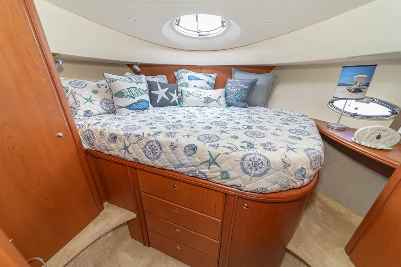 Slide: The Image of Interior of 2004 Silverton 39 MY Diesel yacht featuring cozy bedroom. - 37