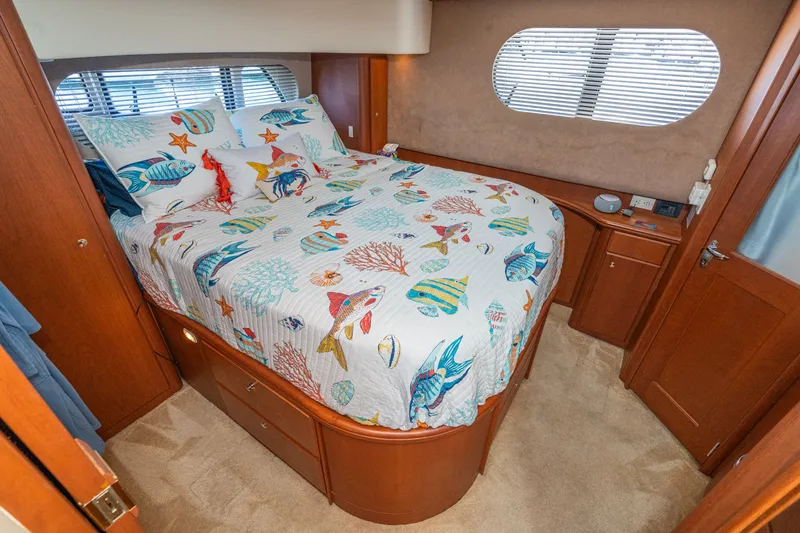 Slide: The Image of Interior of 2004 Silverton 39 MY Diesel with nautical-themed bedding. - 41