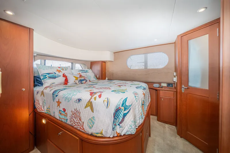 Slide: The Image of Interior of 2004 Silverton 39 MY Diesel with nautical-themed bedding. - 42