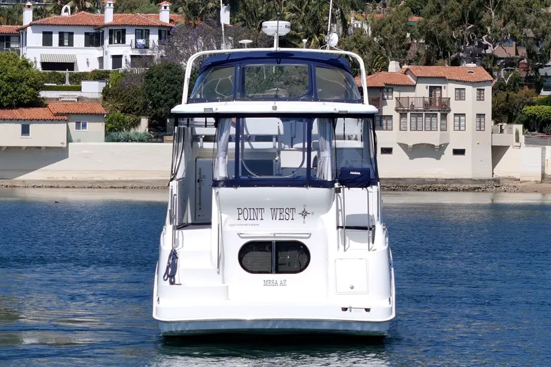 Slide: The Image of 2004 Silverton 39 MY Diesel yacht in front of coastal homes. - 6