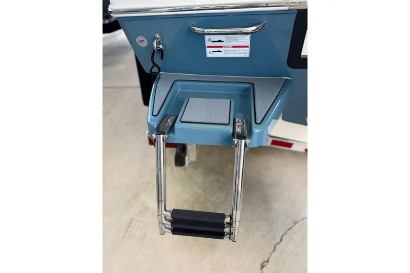 Slide: The Image of 2025 Pathfinder 2200 TRS boat ladder and platform detail in blue finish. - 10