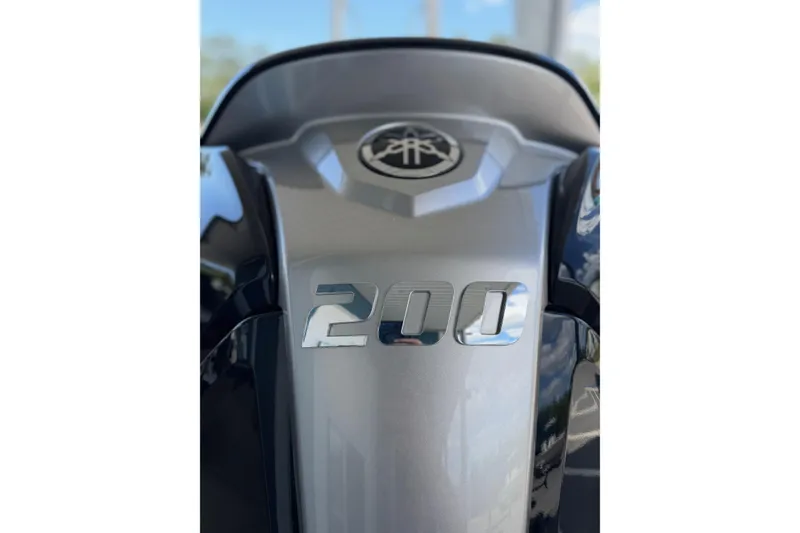 Slide: The Image of Close-up of 2025 Pathfinder 2200 TRS engine cover with "200" emblem. - 12