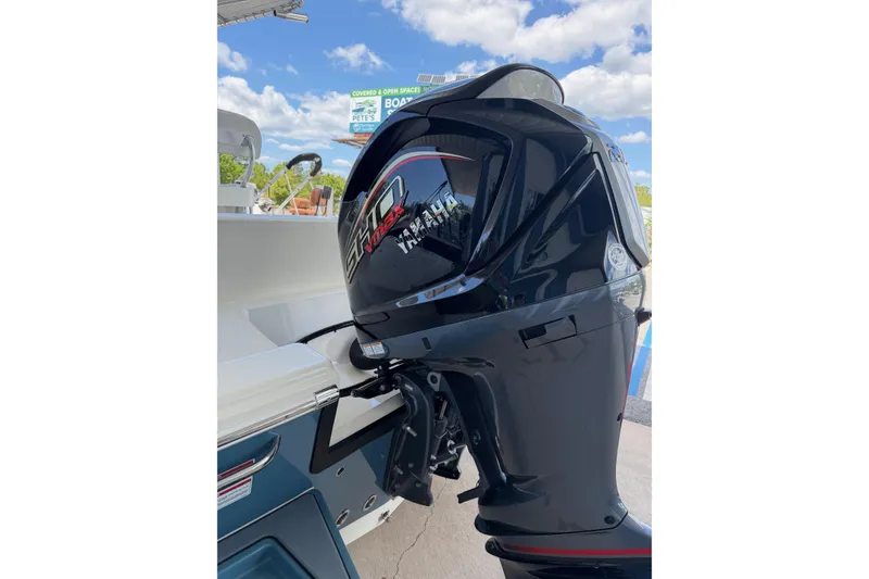 Slide: The Image of 2025 Pathfinder 2200 TRS boat with Yamaha outboard motor under blue sky. - 15