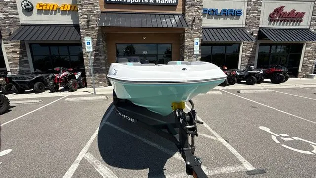 Slide: The Image of 2026 Tahoe T16 boat in front of Powersports & Marine store. - 10