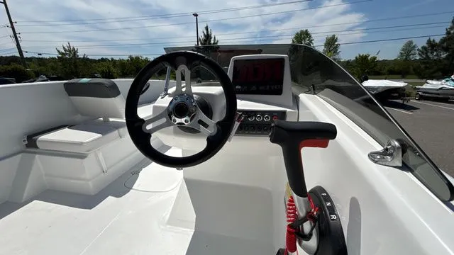 Slide: The Image of Interior view of 2026 Tahoe T16 boat cockpit with steering wheel and throttle. - 12