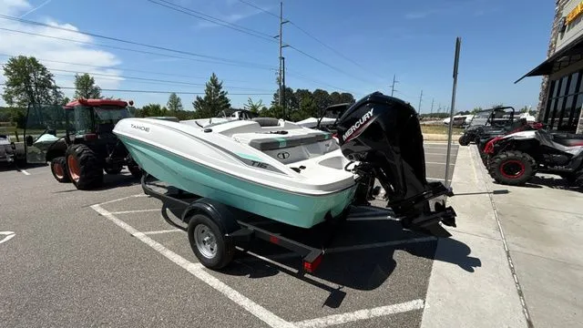 Slide: The Image of 2026 Tahoe T16 boat parked outdoors on a trailer. - 5