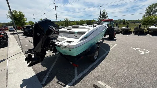 Slide: The Image of 2026 Tahoe T16 boat parked on a trailer outdoors. - 7