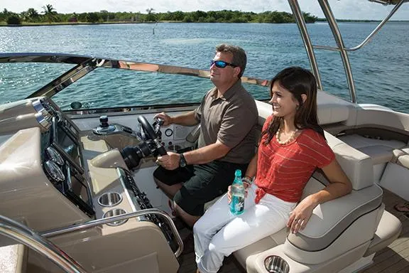 Slide: The Image of Manufacturer Provided Image: Man and woman enjoying a ride on a 2015 Formula 370 Super Sport boat. - 13