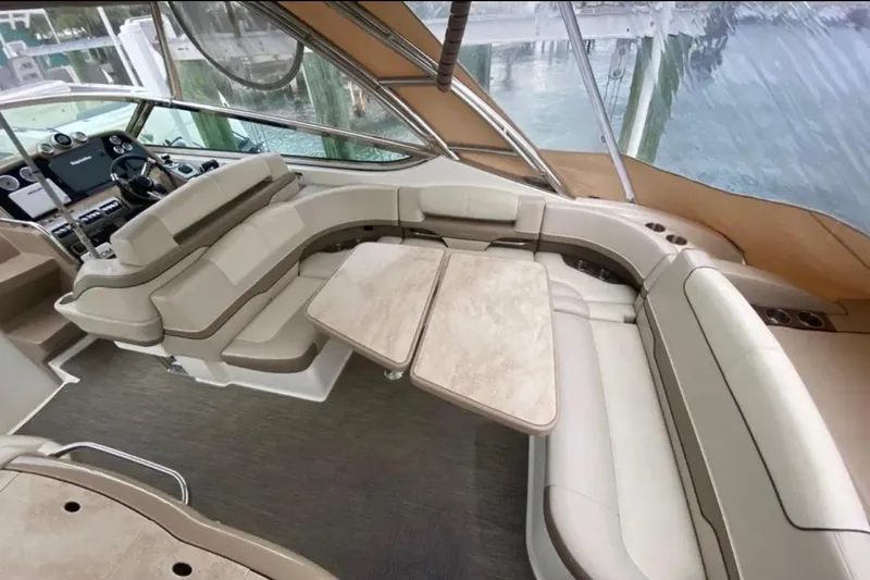 Slide: The Image of Luxurious interior of a 2015 Formula 370 Super Sport yacht with plush seating and table. - 2