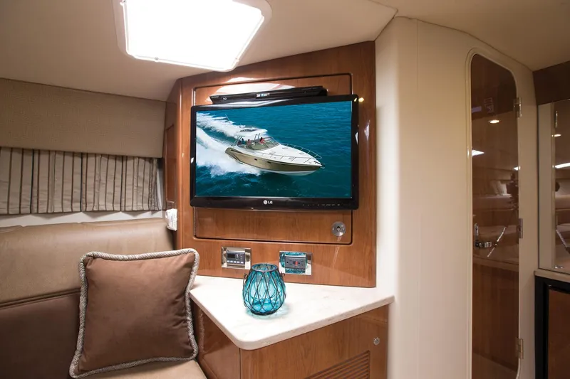 Slide: The Image of Manufacturer Provided Image: Interior of 2015 Formula 370 Super Sport yacht with TV and cozy seating area. - 21