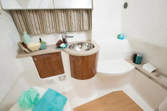 Slide: The Image of Manufacturer Provided Image: 2015 Formula 370 Super Sport boat bathroom with sink, storage, and modern amenities. - 26