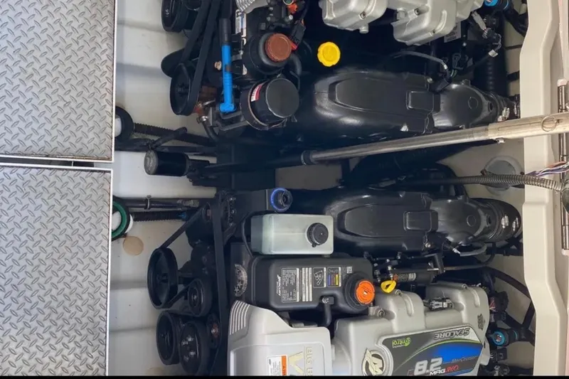 Slide: The Image of Engine compartment of a 2015 Formula 370 Super Sport boat, featuring dual engines. - 4