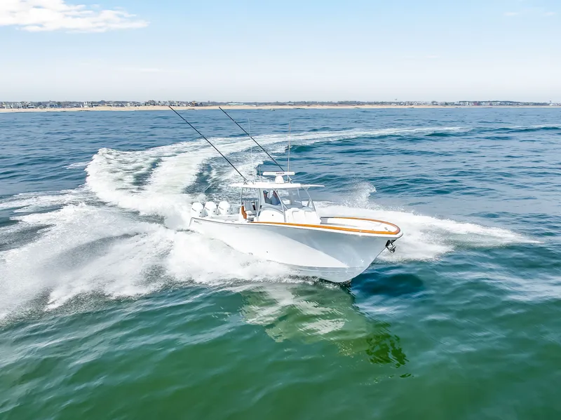 Slide: The Image of 2026 Front Runner 39 Center Console cruising on open sea. - 2