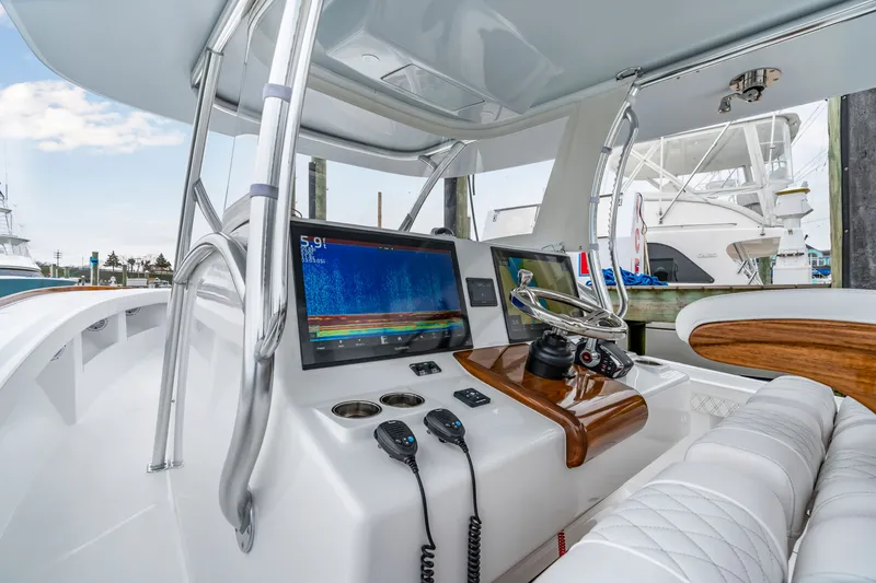 Slide: The Image of Front Runner 39 Center Console 2026 helm with modern electronics. - 26