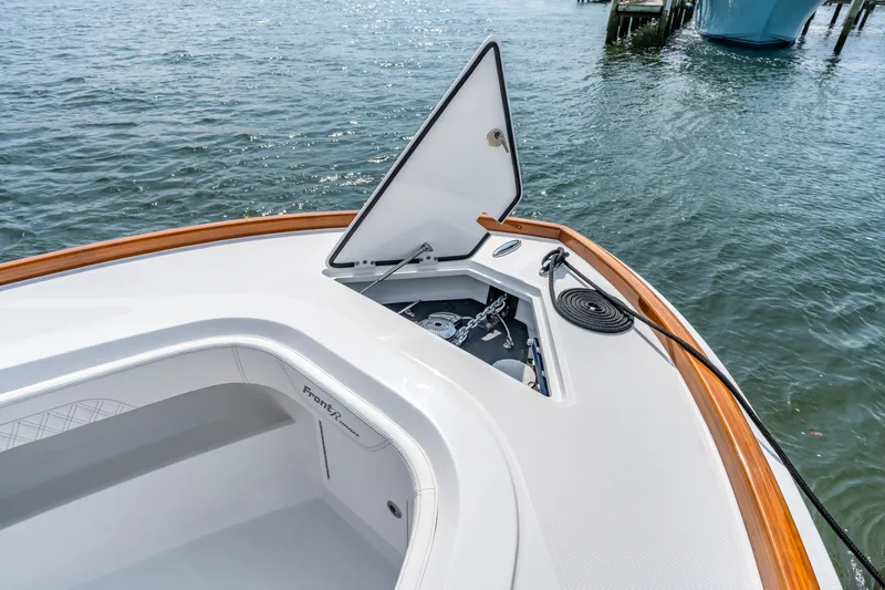 Slide: The Image of Front Runner 39 Center Console 2026 with open anchor hatch on the water. - 41
