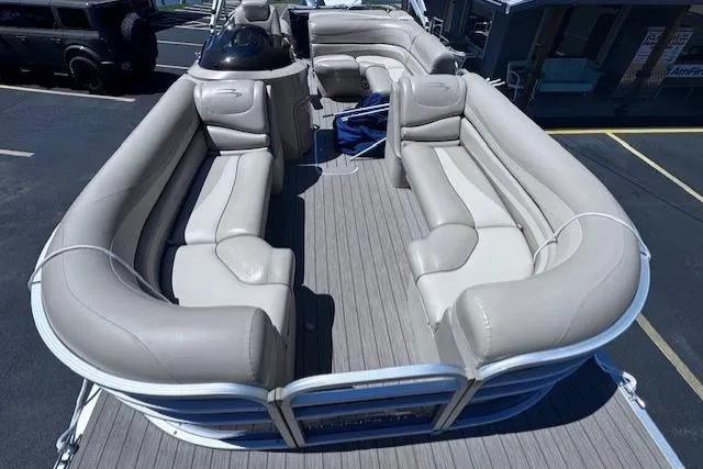 Slide: The Image of 2015 Bennington 2275 GS pontoon boat with spacious seating and sleek design. - 2