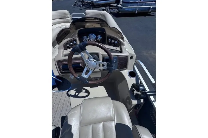 Slide: The Image of Helm of 2015 Bennington 2275 GS boat with steering wheel and dashboard controls. - 5