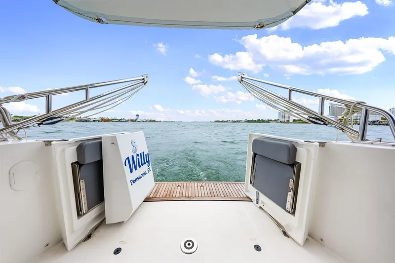 Slide: The Image of 2018 Beneteau Swift Trawler 30, open deck view, overlooking serene waters and blue sky. - 44