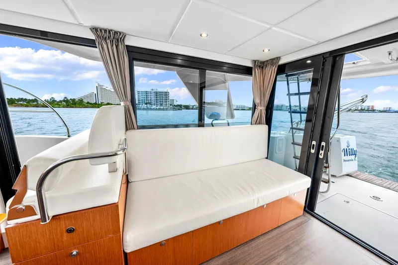 Slide: The Image of Interior of 2018 Beneteau Swift Trawler 30 with waterfront view through large windows. - 55